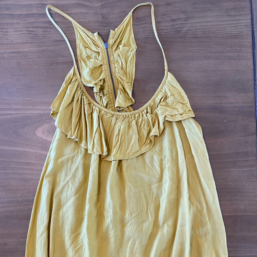 Mustard yellow top with ruffle accent